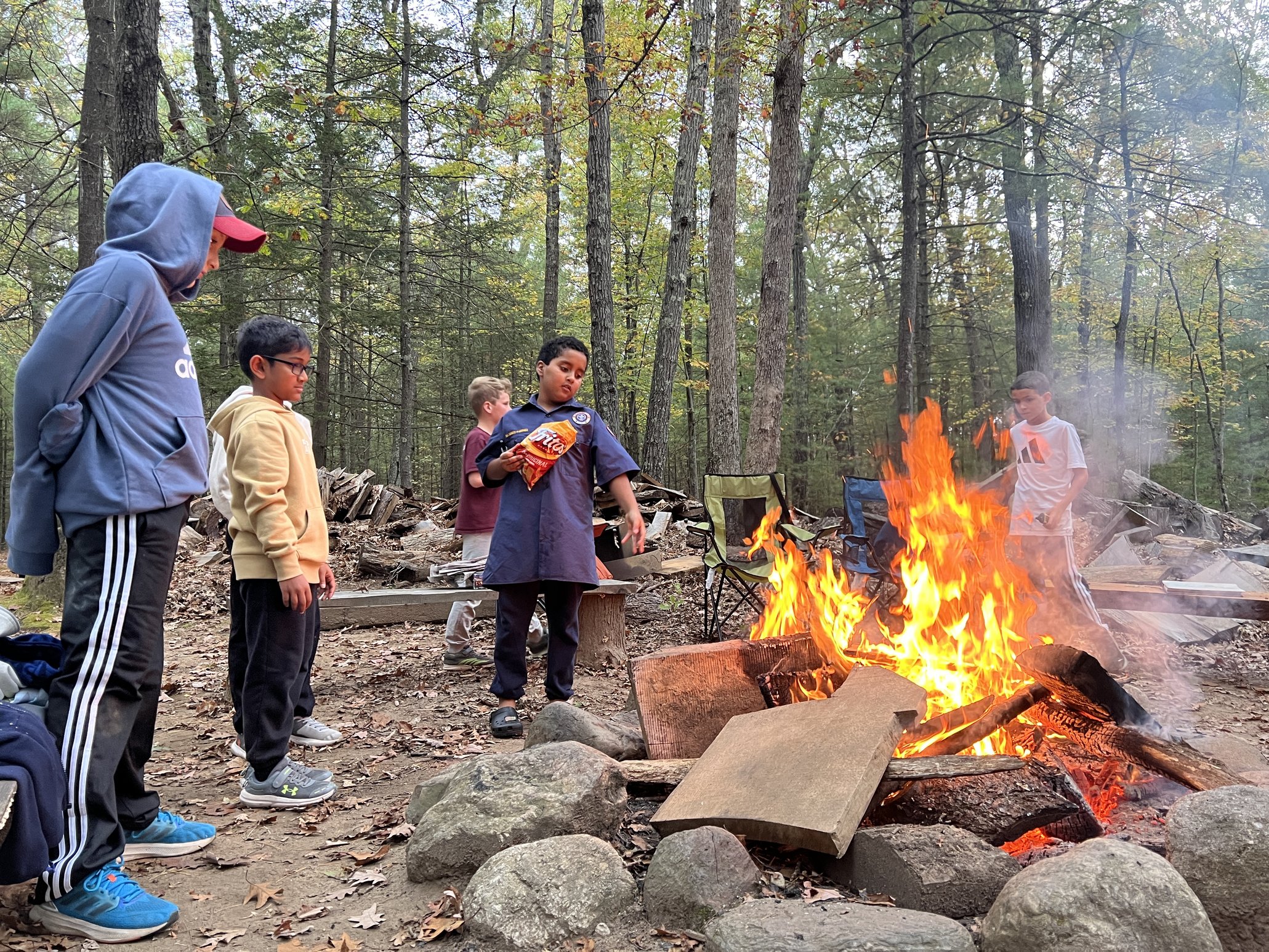 Cub Scouts around a campfire