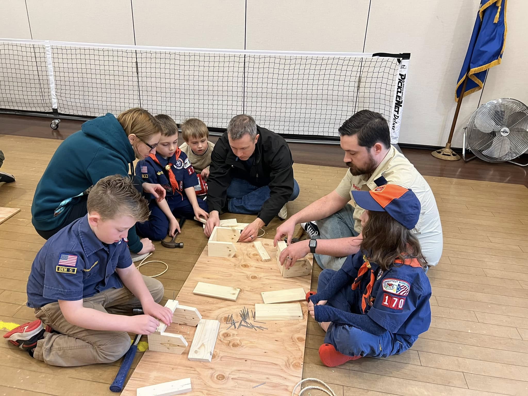 Scout working with wood and tools